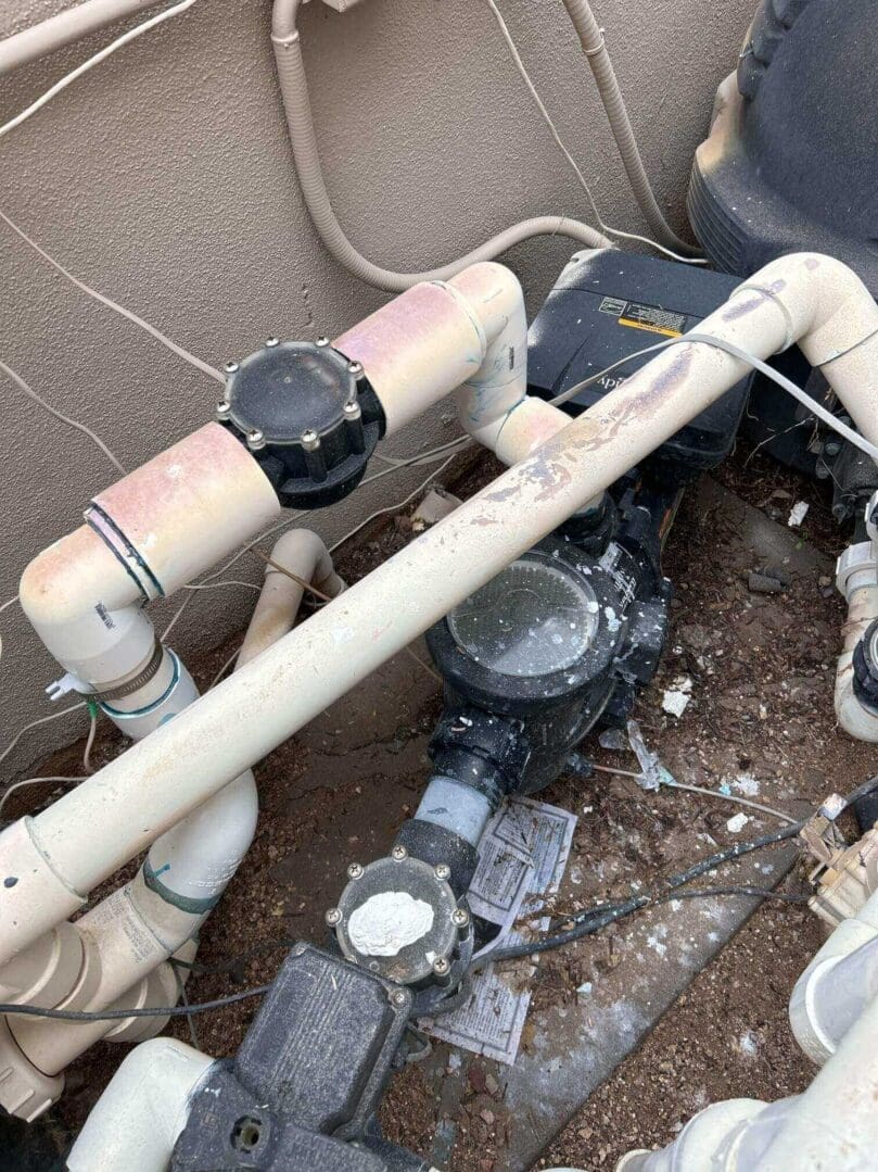 Close-up of painted PVC pool pump plumbing